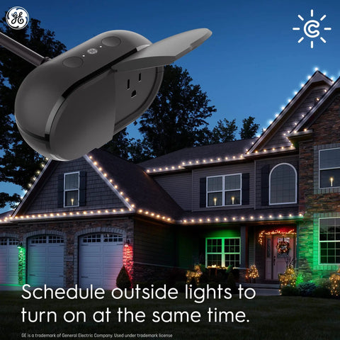 Cync Outdoor Smart Plug With Bluetooth And Wi-Fi Weather-Resistant Outdoor Outlet Socket in use with lit holiday lights