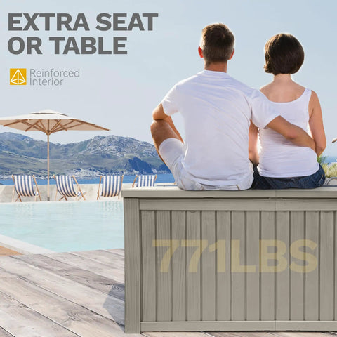 Rear view of two people sitting on a Beefy 220 Gallon Outdoor Deck Storage Box With Removable Divider by pool, light brown.