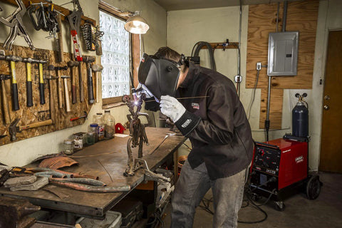 Welder using Viking Industrial Passive Black Welding Helmet For MIG TIG And Stick Welding in workshop, heavy-duty build.