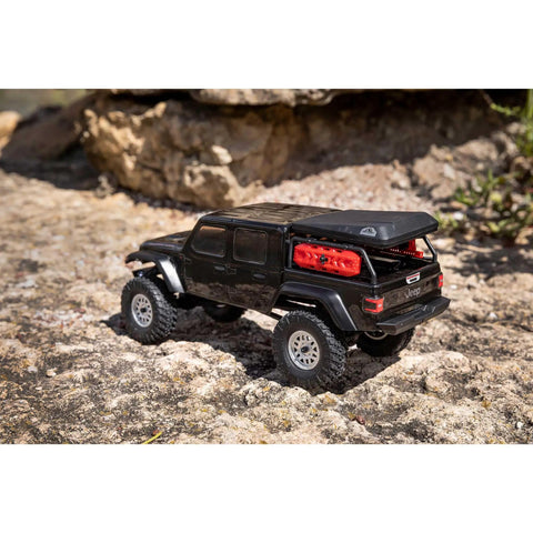 SCX24 Jeep Gladiator One Twenty Fourth Scale 4x4 Rock Crawler Ready To Run Brushed RC Car on rocky terrain