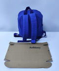 Rear view of Lightweight Daypack For Hiking And Camping In Bold Blue 11 By 9 By 10 Inches Trail Ready And Super Durable Backpack with box