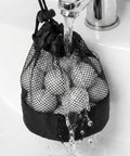3 Pack Golf Ball Bags With Drawstring Mesh Pouches Holds Up To 20 Balls, nylon polyester bag being rinsed in a sink