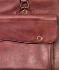 Solid Copper Binding Barrels And Screws For Scrapbooks And Photo Albums Heavy Duty Metal Rivet Replacement Kit on a brown leather background.