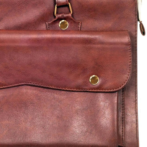 Solid Copper Binding Barrels And Screws For Scrapbooks And Photo Albums Heavy Duty Metal Rivet Replacement Kit on a brown leather background.