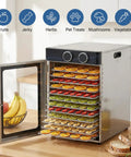 Top Tier Electric Food Dehydrator With 12 Stainless Steel Trays And 1200W Power showcasing dried fruits and herbs, with open door view.