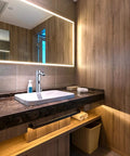 Modern bathroom with undermount sink featuring Touchless Bathroom Sink Faucet With Motion Activated Sensor, chrome finish.