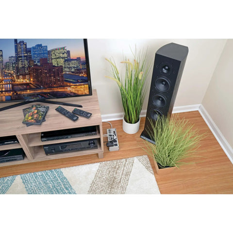 Living room setup with Isobar 8 Outlet Surge Protector Power Strip With 25 Foot Cord, Right Angle Plug, by TV stand and speakers.