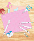 Six Piece Vinyl Tool Kit For DIY Crafters With Scoring Stylus Weeder With Cap Scissors Tweezers Spatula And Scraper displayed on pink mat