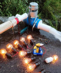 1000W Hydroelectric Turbine Generator 220V Outdoor Water Powered Copper Horizontal Water Generator 3500RPM Efficient River Energy System Built For Remote Setups, Easy No Fuss Installation setup with lit bulbs illustrating power output.