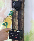 Badass Cast Iron Bear Head Beer Bottle Opener Wall Mounted With Cap Catcher Tray For Man Cave Chill Spot Or Garage Wall Rustic Grizzly Gear For Cold Ones, showing a hand opening a bottle.