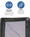 Corner view of Heavy Duty Waterproof Tarp 29 ft 2 in by 59 ft showing green and silver reversible sides with grommet