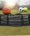 Large Mesh Sports Gear Bag For Gym And Outdoors with basketball, soccer ball, and volleyball on grass
