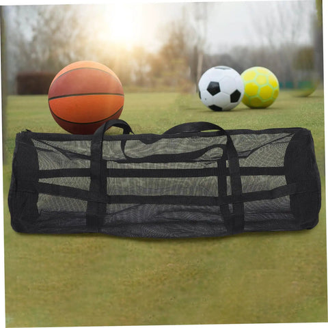 Large Mesh Sports Gear Bag For Gym And Outdoors with basketball, soccer ball, and volleyball on grass
