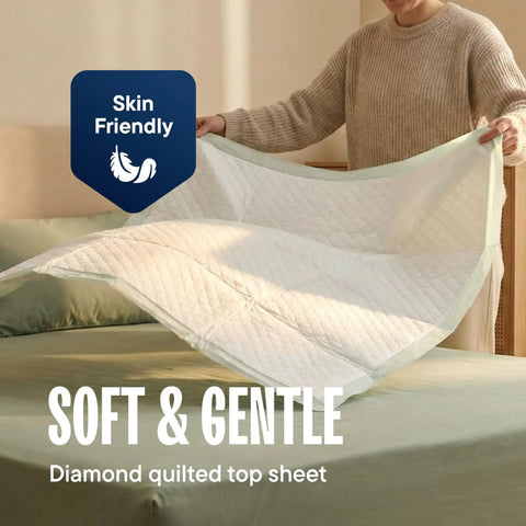 Extra Large Disposable Bed Pads 30 By 36 Inches 50 Pack Super Absorbent Incontinence Underpads displayed by a person, showing diamond quilted top.