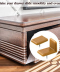 Top Shelf Furniture Hardware Pack Including Thirty Heavy Duty Plastic Drawer Stops For Dresser Repairs Square And L Shaped Cabinet Gliders Zero Hassle Setup, features square and L shaped gliders on wooden dresser.