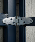 Beefy 6 Pack Heavy Duty Strap Hinges 4 Inch Iron T Shape With Mounting Screws For Light Masonry Door Frames Exterior And Residential Use 180 Degree Opening Durable Silver Finish installed on dark metal gate