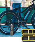 Premium Heavy Duty Portable Air Compressor Storage Case For Tire Inflator And Charging Cables Dope Protection Yellow with bike background.