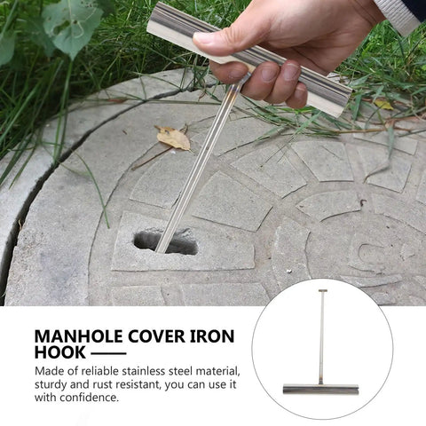 No Sweat Heavy Duty Manhole Cover Lift Hook With T Shaped Steel Puller For Drain Well Lid Opener and Roller Shutter Doors Rust Proof Stainless Steel Industrial Grabber Tool Top Shelf 43 Cm Grip in use lifting a manhole cover.