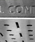 Close-up of metal pegboard with 'Wall Control' lettering, part of Power Tool Storage Organizer Kit With Cordless Drill Holder And Charging Station.