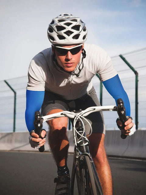 Cyclist wearing blue Unisex UV Protection Arm Sleeves Set 12 Pairs Long Cooling Cover For Outdoor Adventures