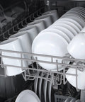 Smooth Cleaning Countertop Dishwasher 18 Inch In Crisp White with dishes and cups loaded in the rack.