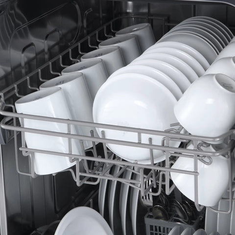 Smooth Cleaning Countertop Dishwasher 18 Inch In Crisp White with dishes and cups loaded in the rack.