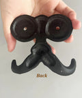 Back view of Badass Vintage Cast Iron Beard Shaped Wall Hook Kit with holes for mounting, ideal for hanging coats and bags.