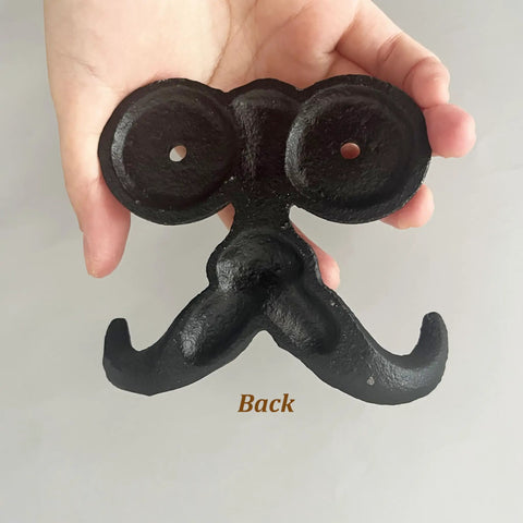 Back view of Badass Vintage Cast Iron Beard Shaped Wall Hook Kit with holes for mounting, ideal for hanging coats and bags.