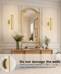 Bosomfr 14.8in Wall Sconces Rechargeable Battery Operated Wall Light in modern gold finish by a mirror in elegant setting.