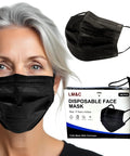 Premium Black Face Masks 50 Pack Featuring True 3 Ply Construction Cleanroom Manufactured For Straight Up Daily Protection Flexible Nose Bar Comfortable Ear Loops Built Right For Everyday Grind on a woman with a black mask.