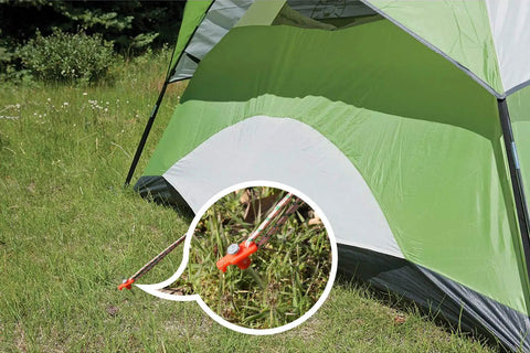 11 Inch Tent Stakes 10 Pack Heavy Duty Ground Anchors for Outdoor Camping and Gazebo Setup securing a green tent