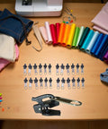 Universal Zipper Repair Kit 24 Pieces Quick Tool Free Fix For Zip Sliders And Teeth On Jackets Bags Tents And DIY Crafts Great For Nylon Metal Or Plastic Zippers And Sewing Notions And Supplies displayed on a table with sewing materials.