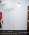 CFL T2 Twist Light Bulb 60W Equivalent 13W 800 Lumens Daylight 6500K 3 Pack illuminating a room with tools.