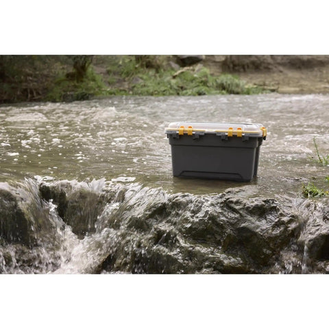 Tough As Nails 12 Gallon Waterproof Storage Tote With Clear Polycarbonate Lid in a stream, showcasing durability and water resistance.