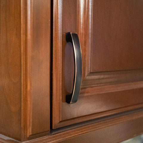 Solid Zinc Alloy Kitchen Cabinet Pull Handle in Oil Rubbed Bronze Simplicity Series Traditional Classic Design four and three eighths inch on wood cabinet
