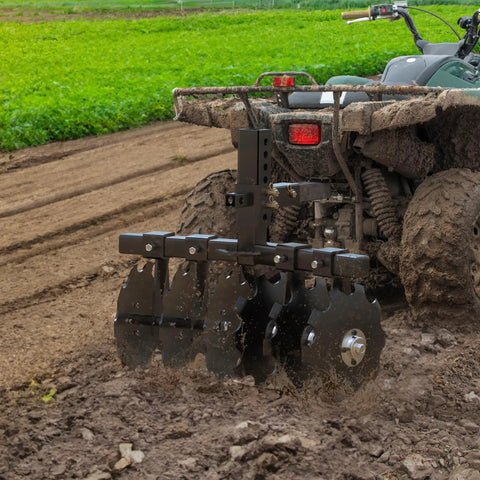 28 Inch Tractor Disc Plow Harrow With 2 Inch Receiver For ATV Pull Behind Tiller on muddy field, adjustable height, black