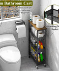 4 Tier Slim Rolling Storage Cart With Wood Top For Narrow Spaces Between Appliances In Small Kitchens, Laundry Rooms Or Bathrooms, Metal Mobile Shelf Unit Organizer On Wheels With Handle shown in bathroom next to toilet.