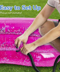 Person inflating pink 3-level transparent glitter pool showing easy setup of Sparkly 3 Level Inflatable Kiddie Pool For Beating The Heat In The Backyard Transparent Glitter Pool With Cushioned Bottom And Easy To Inflate Design Perfect Summer Toy For Kids Ages 3 And Up