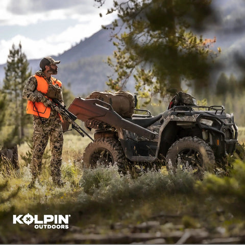 Hunter with Stronghold Gun Boot L with Autolatch Mount Black Hard Case on ATV in wilderness
