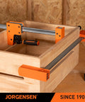 48-Inch Heavy Duty Bar Clamps Set With Parallel Jaws, 1500 Lbs Clamping Force in use on wooden box, maple handles visible