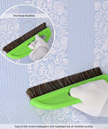 Hand using Wallpaper Smoothing Tool Kit With 10 Inch Smoothing Brush on patterned wallpaper close-up.