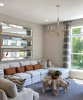 Montreal 29 Inch Six Light French Country Chandelier With Adjustable Height In Smoked Birch Finish in a bright living space.
