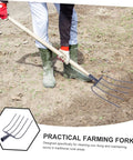 Handheld Manure Fork For Farming With Ergonomic Handle Iron Garden Fork in use on a dirt surface for lawn and yard cleanup.