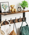 Wall Mount Coat Rack With Shelf And Hooks, No-Fuss Space Saving Entryway Organizer with items on top and bags hanging below.