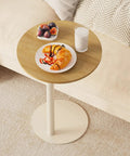 C Shaped Round End Table With Metal Legs For Couch, Snack Sofa Tray Or Laptop Desk next to a sofa with food and drink