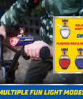 Child holding bike handles with Paw Patrol LED Light Gift Set, Flashlight, Lantern, And Bike Light Bundle For Kids mounted on bike