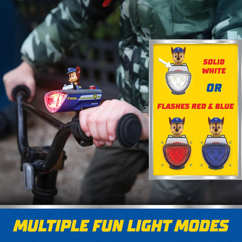 Child holding bike handles with Paw Patrol LED Light Gift Set, Flashlight, Lantern, And Bike Light Bundle For Kids mounted on bike