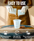 Top Tier Table Top Epoxy Resin Kit For Bars And Counters With Killer UV Resistance And Straight Up Crystal Clear High Gloss Finish For Serious Handmade Creators, ingredients being mixed in clear cups.