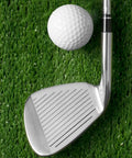 Golf iron with 10 Pack.370 Golf Iron Ferrules With Black Body And Silver Ring next to a golf ball on grass