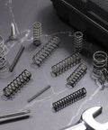 Ten Pack 7mm OD Compression Springs With 0.6mm Wire Diameter And 15mm Free Length in spring steel for DIY repairs on dark surface